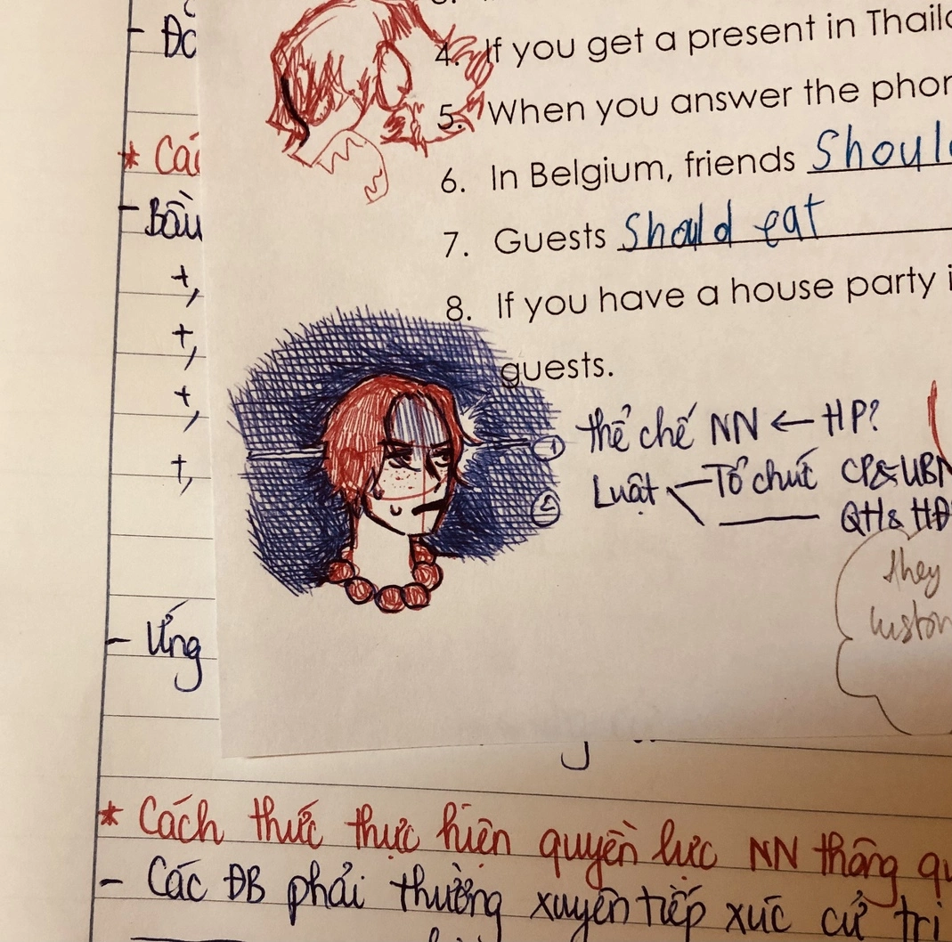 A doodle that was apparently drawn with a red ballpoint pen and another blue one.